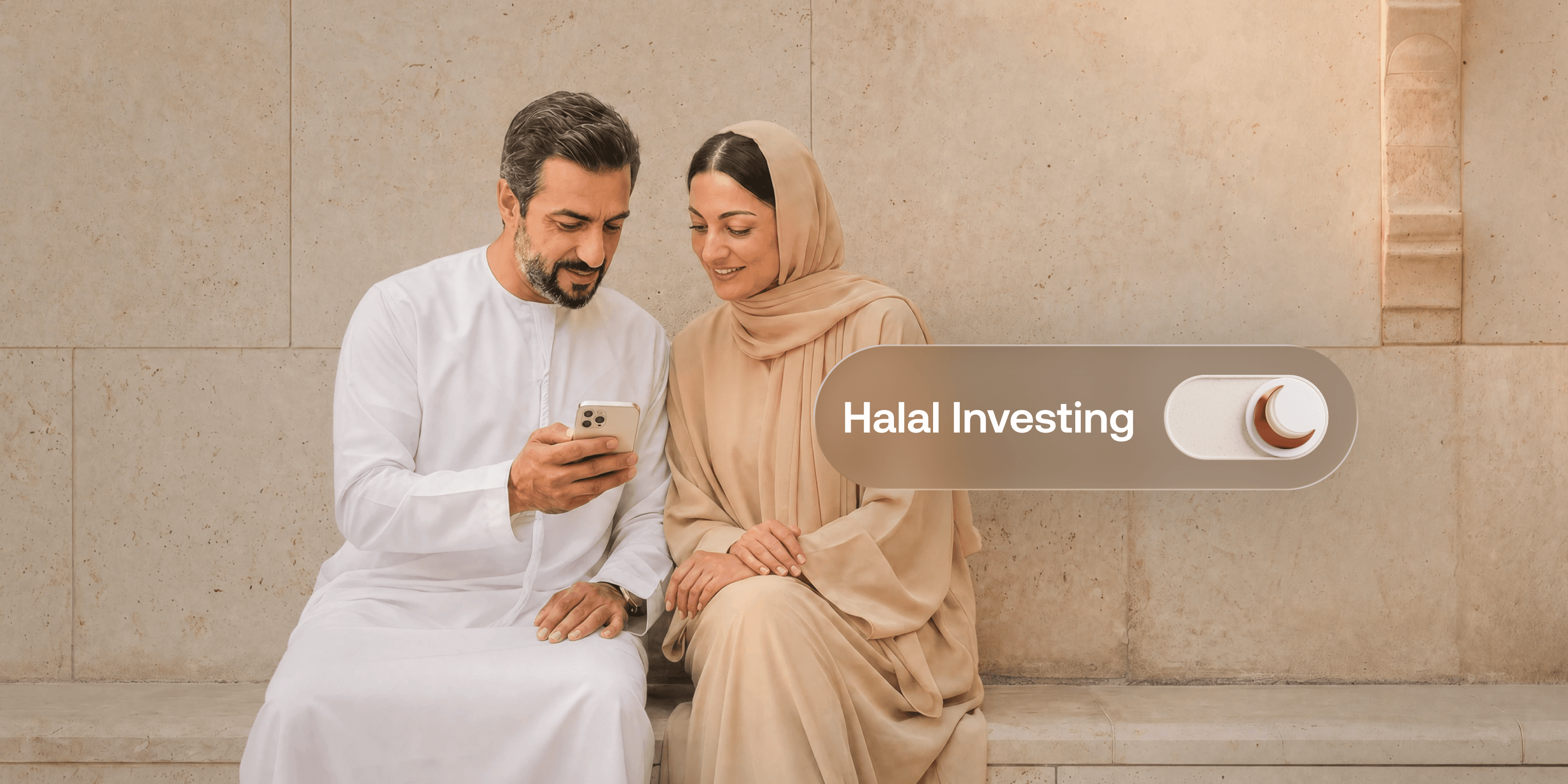 A couple in traditional Emirati dress sit against a sandstone wall reviewing an investment app on a smartphone, next to a toggle switch labelled "Halal Investing" with a crescent moon icon.