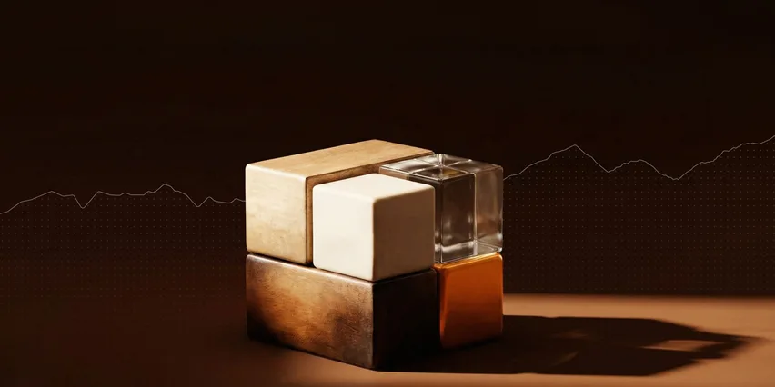 Four material cubes — wood, marble, glass, and gold — stacked on a metallic base against a dark background with a white line chart, representing diversified passive income streams