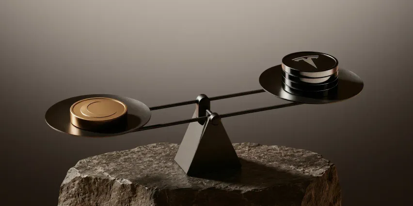 Balance scale on a rough stone block, with a single gold coin marked with a crescent moon on the lower pan and a stack of dark coins bearing the Tesla logo on the raised pan.